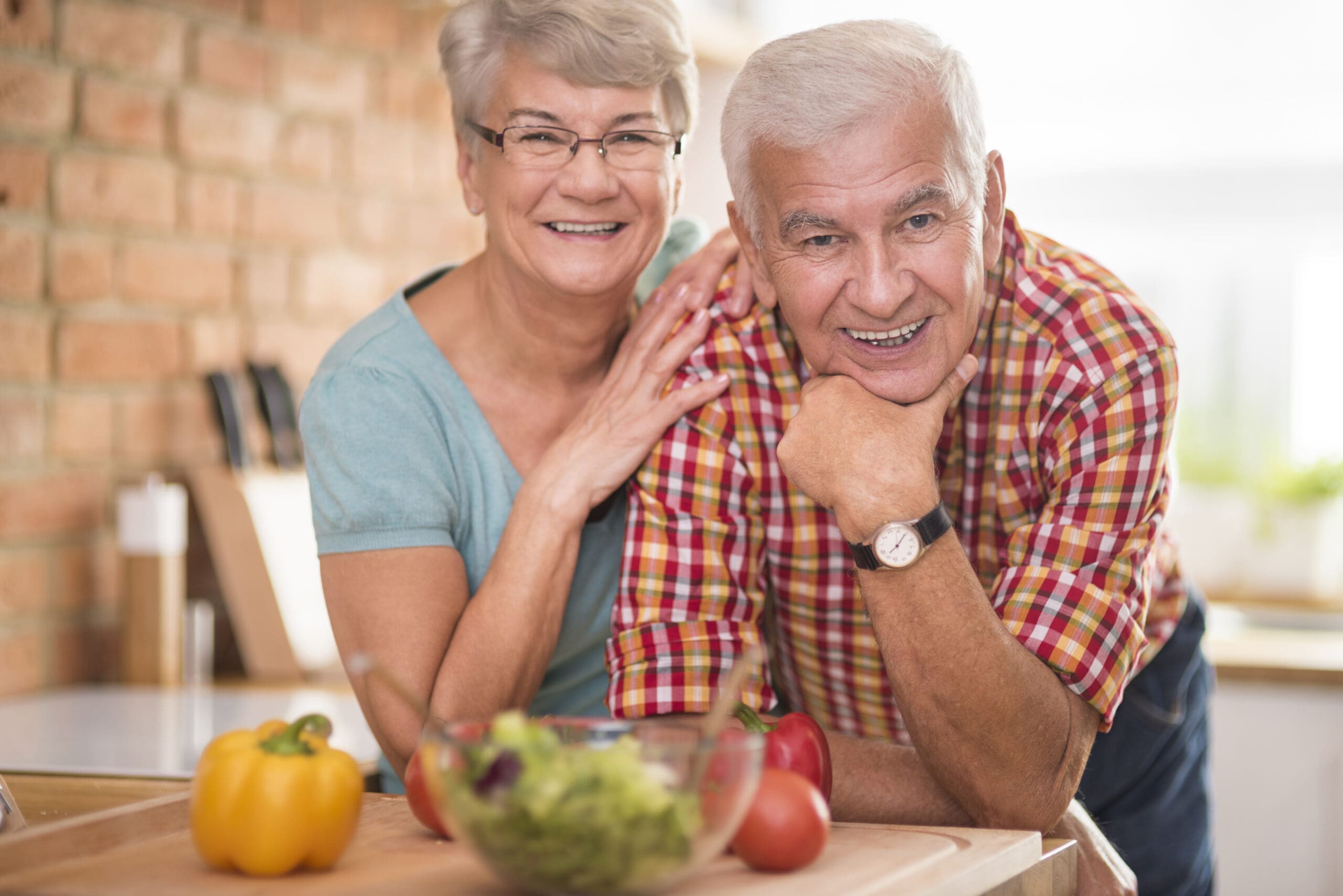 Portrait of cheerful marriage at the domestic kitchen