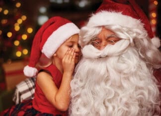 Santa with child whispering