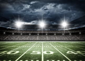 Football – Best Places to Watch Your Favorite Teams Football Stadium with Stormy sky